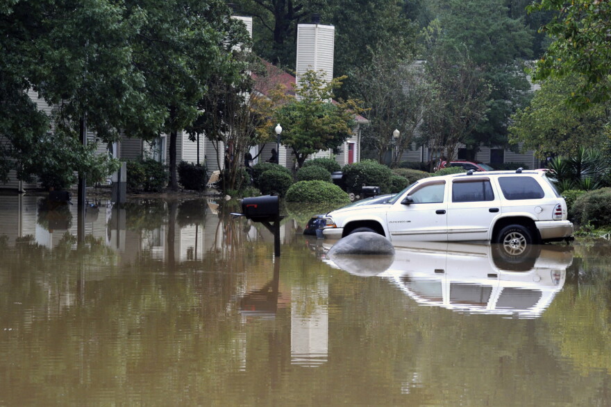 A flooded neighborhood is shown in Pelham, Ala., Thursday, Oct. 7, 2021. Parts of Alabama remain under a flash flood watch after a day of high water across the state, with as much as 6 inches of rain covering roads and trapping people.