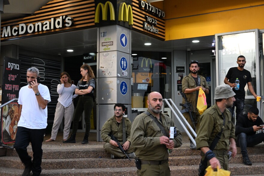 Israeli soldiers and civilians at the gas station and kosher McDonald's in Beit Kama Junction, near Sderot, Israel.