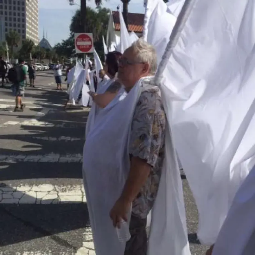 When news broke that members of a Kansas-based church who protest funerals were to show up in Orlando, draped in white, a dozen or so members of Orlando’s theater community wore expansive wings on their backs made of large, white sheets of cloth and created a curtain between the Kansas church members and the family of Christopher Andrew Leinonen as they paid their last respects at the Cathedral of St. Luke’s.