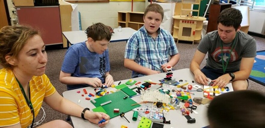 Campers at Community Connections work on a project in the summer of 2019.