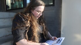 Samantha Butler looks at a copy of her marriage license.