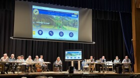 Archbald Borough Council members and representatives from data center developer, Cornell Realty Management LLC, sit on stage at Valley View High School for a conditional use hearing.
