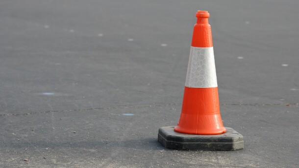 A traffic cone on a city street.