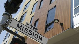 A street sign hangs outside a then-new apartment building on Mission Street, Tuesday, June 2, 2015, in San Francisco. (Eric Risberg/AP)