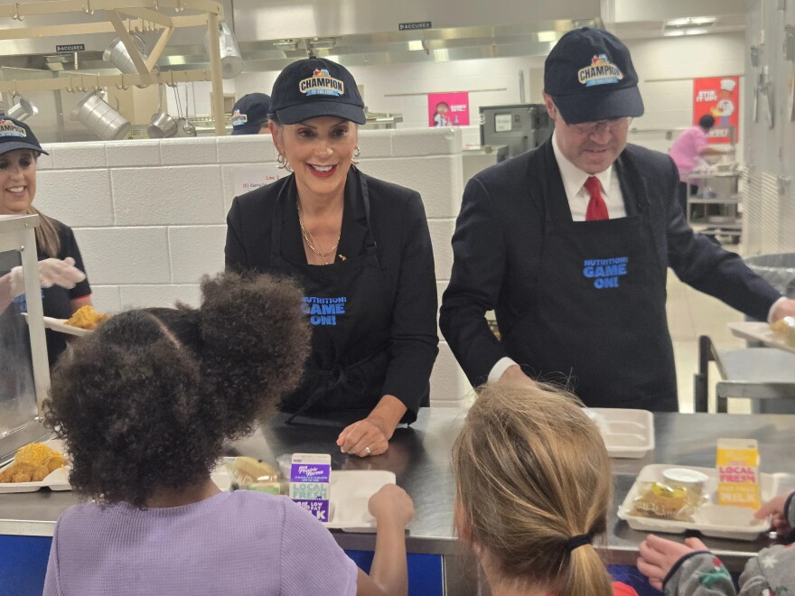Governor Gretchen Whitmer and state Senator Sean McCann pass out school lunches in Kalamazoo on September 8, 2026.