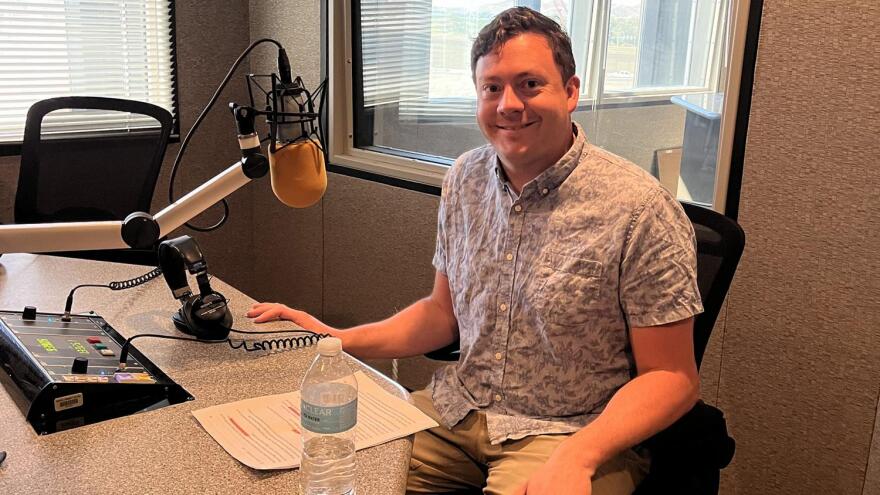 Man in beige shirt in studio
