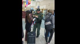 A screenshot from a video recorded by Sheila Sicilia of a border patrol agent at the Regional Transportation Center in Syracuse. SHEILA SICILIA