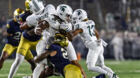 Notre Dame linebacker Kyngstonn Viliamu-Asa tackles Michigan State running back Cam Edwards