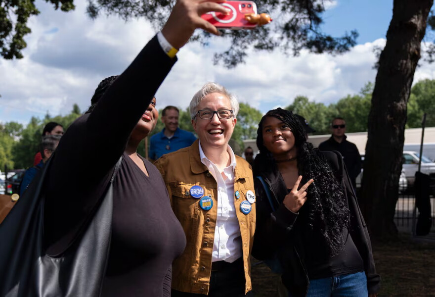 Oregon Gov. Tina Kotek poses for a selfie at the Oaks Amusement Park in Portland, Ore., where several unions held a Labor Day picnic on Sept. 7, 2026. Kotek spent part of Monday campaigning at the picnic and mingling with other election candidates ahead of the November primary.