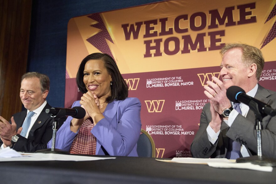 Washington Commanders controlling owner Josh Harris, from left, District of Columbia Mayor Muriel Bowser and NFL Commissioner Roger Goodell announce a new home for the NFL football team on the site of the old RFK Stadium, Monday, April 28, 2025, at the National Press Club in Washington. (AP Photo/Jacquelyn Martin)