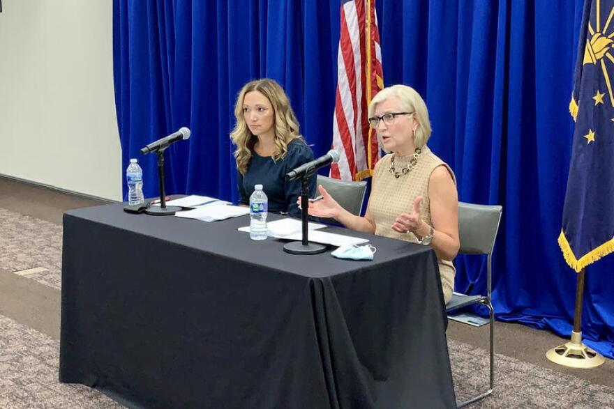 State Health Commissioner Dr. Kris Box, right, speaks at a press conference in August 2021. Dr. Lindsay Weaver, Indiana Department of Health chief medical officer, sits next to her. The governor's office announced announced Friday, May 12, Box would be retiring from her position and Weaver would be succeeding her.