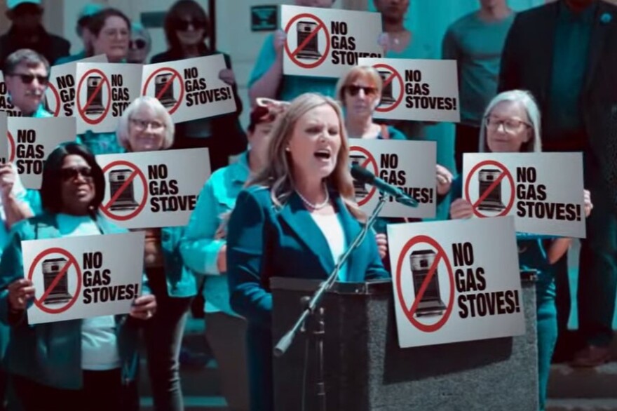 A new negative advertisement from Republican Mike Braun digitally altered the campaign signs at this Jennifer McCormick rally to say “No Gas Stoves!” The version sent to telesivions “mistakenly” omitted the legally mandated disclaimer at the bottom of the screen, according to Braun’s campaign.
