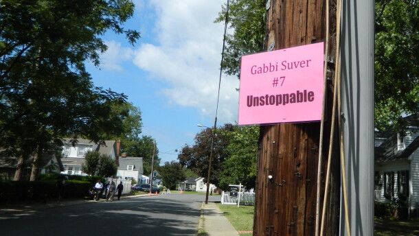 Posters Deborah White hung around Cambridge donning Gabrielle Suver's bib number.