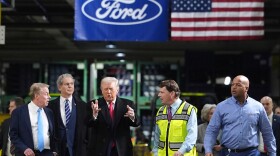 President Donald Trump speaks to, from left Bill Ford, Executive Chairman of Ford, Treasury Secretary Scott Bessent, Jim Farley, CEO of Ford, and Corey Williams, Ford River Rouge Plant Manager, during a tour of the Ford River Rogue complex, Tuesday, Jan. 13, 2026, in Dearborn, Mich.
