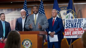 Rep. Byron Donalds, R-Fla., center, flanked by Rep. Chip Roy, R-Texas, left, and Rep. Ralph Norman, R-S.C., right, speaks to reporters as the conservative House Freedom Caucus slams the Senate for not acting on the Save America Act at the Capitol in Washington, Thursday, June 25, 2026.