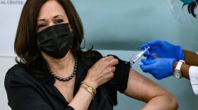 Vice President-elect Kamala Harris is administered a COVID-19 vaccine by registered nurse Patricia Cummings at the United Medical Center in Washington, DC.