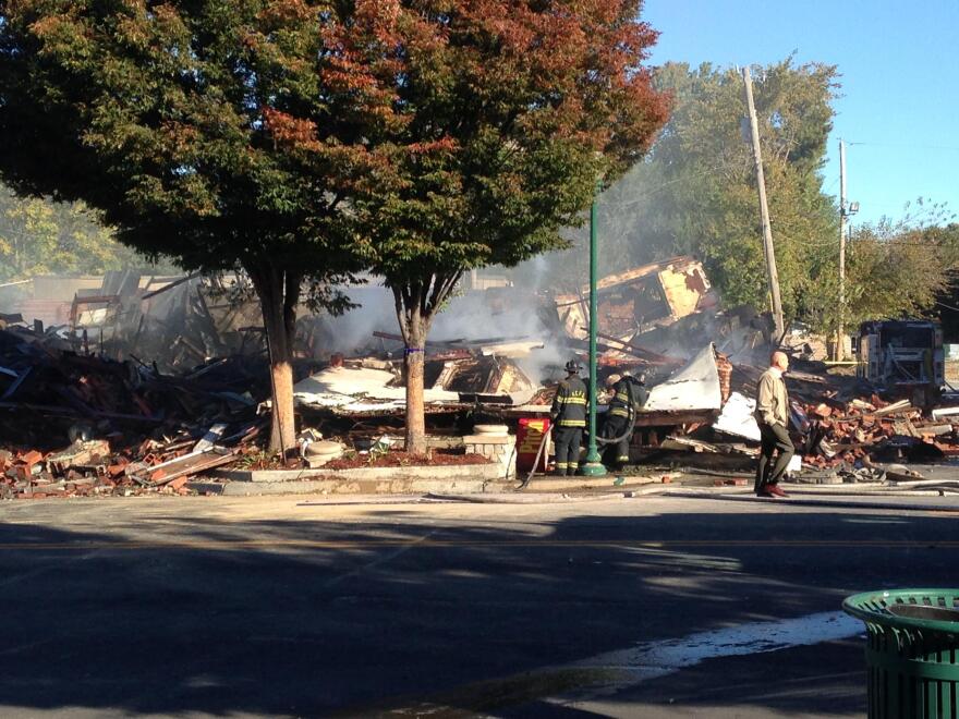A 2015 fire destroyed a building on the corner of Independence and Prospect avenues. Neighbors and developers are at odds over a proposed strip mall at the site. 