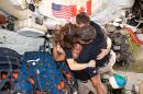 The Artemis II crew – (clockwise from left) Mission Specialist Christina Koch, Mission Specialist Jeremy Hansen, Commander Reid Wiseman, and Pilot Victor Glover – take time out for a group hug inside the Orion spacecraft on their way home. Following a swing around the far side of the Moon on April 6, 2026, the crew exited the lunar sphere of influence (the point at which the Moon's gravity has a stronger pull on Orion than the Earth's) on April 7, and are headed back to Earth for a splashdown in the Pacific Ocean on April 10. The crew was selected in April 2023, and have been training together for their mission for the past three years.