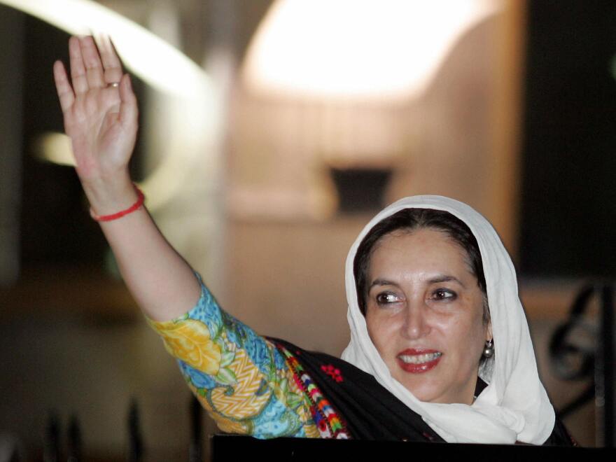 Benazir Bhutto, who served two terms as Pakistan's prime minister, waves to supporters at the Islamabad International airport on Nov. 6, 2007. She was killed in a bombing attack the following month.