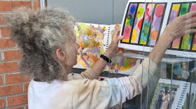 Marie Hertzler turns the pages of the art books at the Yellow Springs Public Library.