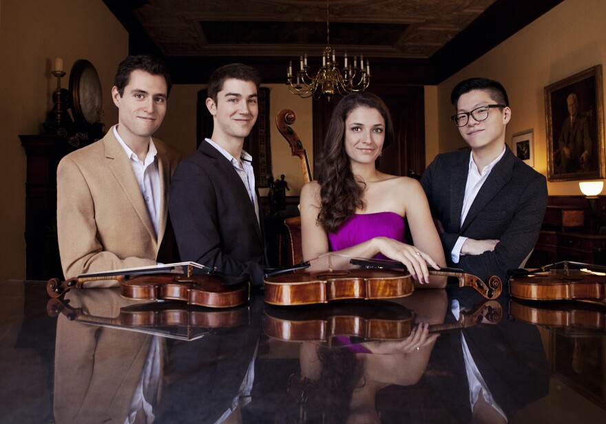 color photo of the Dover Quartet with their instruments