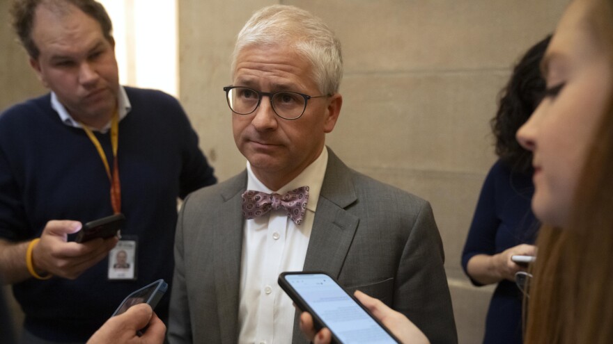 Rep. Patrick McHenry, R-N.C., talks to reporters hours before Rep. Kevin McCarthy, R-Calif., was ousted as speaker on Tuesday. McHenry was named speaker pro tempore and will temporarily lead the House.