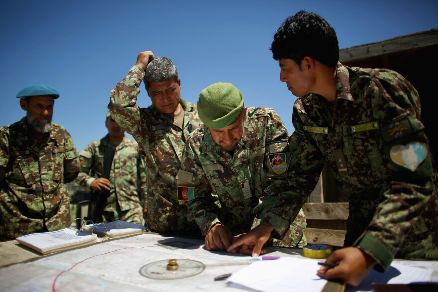 Afghan soldiers plot coordinates for artillery strikes against Taliban fighters in the hills of Nangahar Province in eastern Afghanistan in 2015.