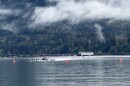 An eight-person boat crosses the finish line at a Dexter Lake regatta in April 2026.