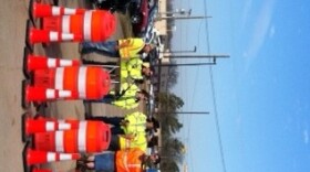 Workers pose at a construction news conference.