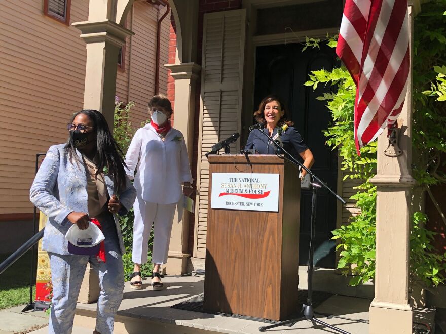 Mayor Lovely Warren, Susan B. Anthony Museum&House president and CEO Deborah Hughes, and Lt. Gov. Kathy Hochul (speaking) in front of Anthony's house on Madison St. in Rochester.