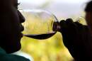 A guest samples a glass of wine during a tasting. (Justin Sullivan/Getty Images)