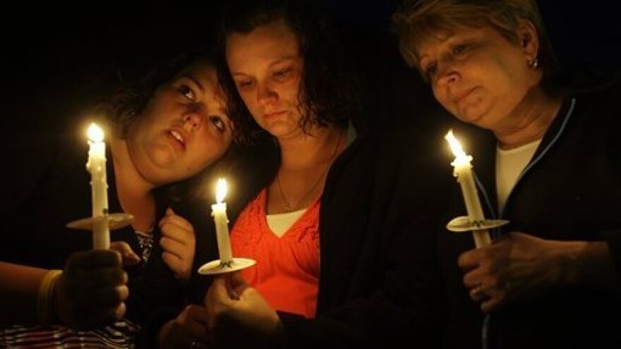 Relatives of Dean Jones, one of the 29 miners killed in the April 5 explosion of the Upper Big Branch mine, gathered for a vigil on April 10 with other families of the blast victims. From left are Julie Jones, Cassie Jones and Susan England.