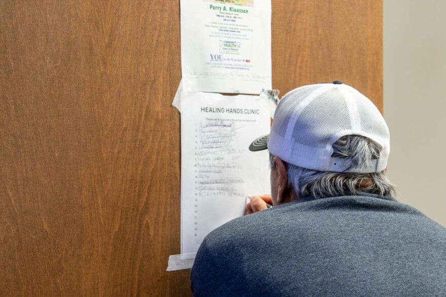 A man signs up for an appointment at the Healing Hands clinic inside the Oklahoma City Homeless Alliance. The clinic offers a low-barrier setting for people experiencing homelessness to access medical care.