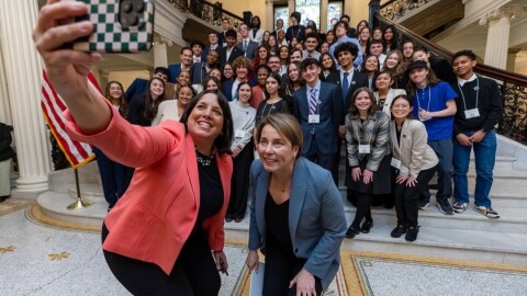 Lieutenant governor Kim Driscoll takes a selfie with Governor Maura Healey and her first youth advisory council.