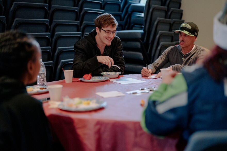 Harrison Schapelhouman (center) shares a moment with members of an addiction and family support group led by his mother on Dec. 8, 2019, after the community church service at True Hope Community Church in Issaquah, Wash.