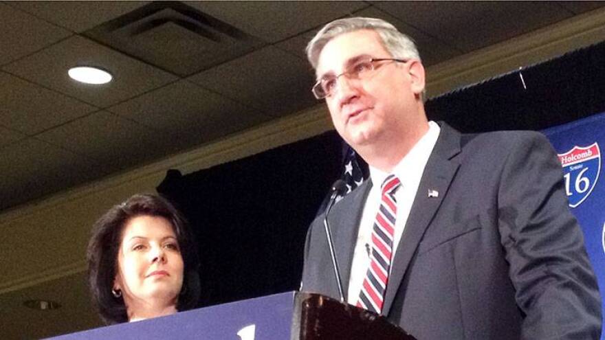 Eric Holcomb announces his candidacy for the U.S. Senate as his wife, Janet, looks on.