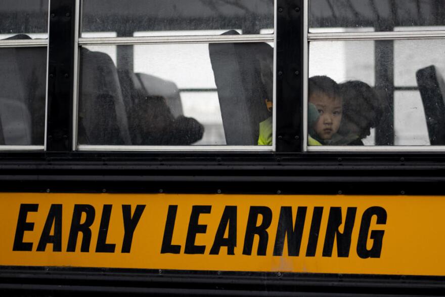 River Yang looks out the window of a school bus as it prepares to depart at the Meadow Lakes CCS Early Learning, a Head Start center, Monday, May 6, 2024, in Wasilla, Alaska. (Lindsey Wasson/AP)