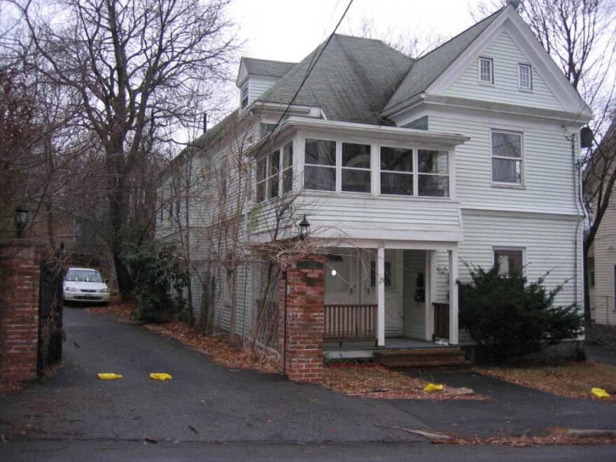 Katty Familia says she saved for 20 years to buy this pale green clapboard house in Boston's Hyde Park neighborhood.