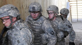 A team practices raiding a house during training at Fort Campbell.