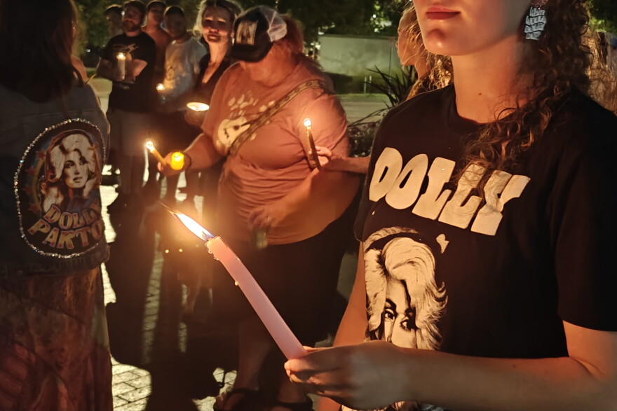Dolly Parton fan with candle at vigil at IU 