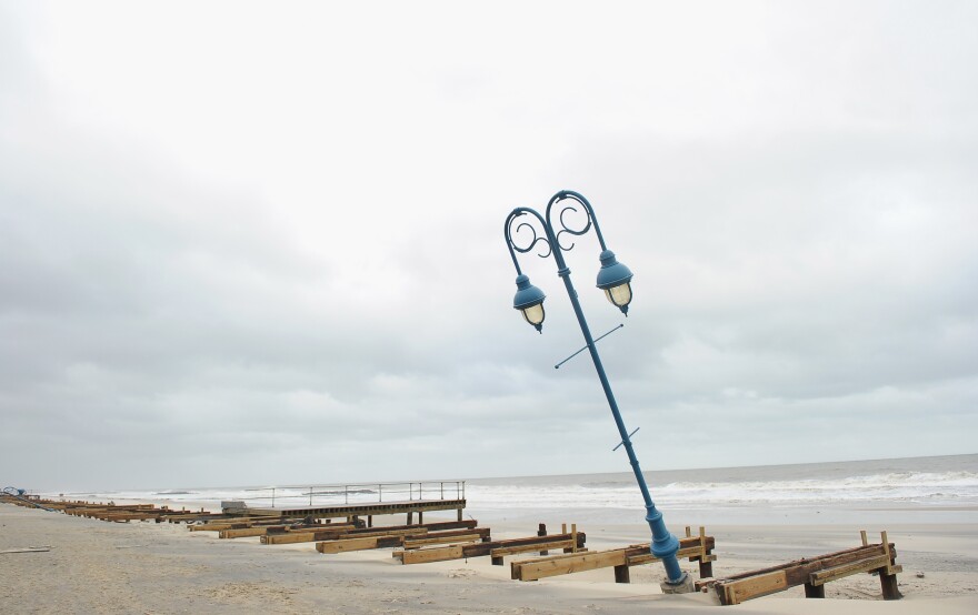 What remains of the 1.2-mile boardwalk sits on the beach on Oct. 30 in Belmar, N.J.