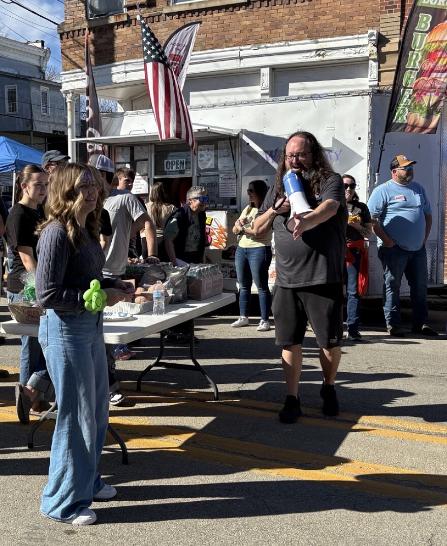 Festival organizer Ian Corbin directs the meat-themed games.
