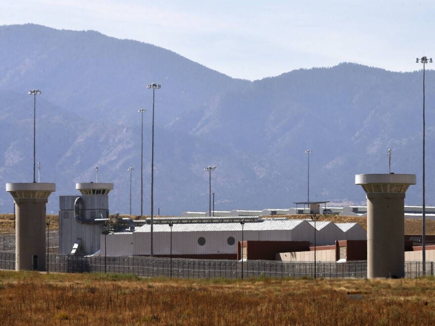 A guard tower looms over a federal prison complex which houses a Supermax facility outside Florence, Colo., in 2015.