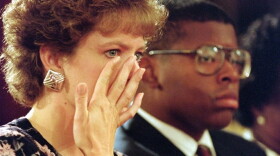 Virginia Thomas, wife of then-Supreme Court nominee Clarence Thomas, wipes away a tear during her husband's 1991 confirmation hearings. Thomas was accused of sexual harassment by former aide Anita Hill.