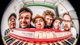 the band euforquestra posing for a photograph 