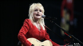 FILE - Dolly Parton performs at a United Way of America convention in Detroit, Friday, May 15, 2009.
