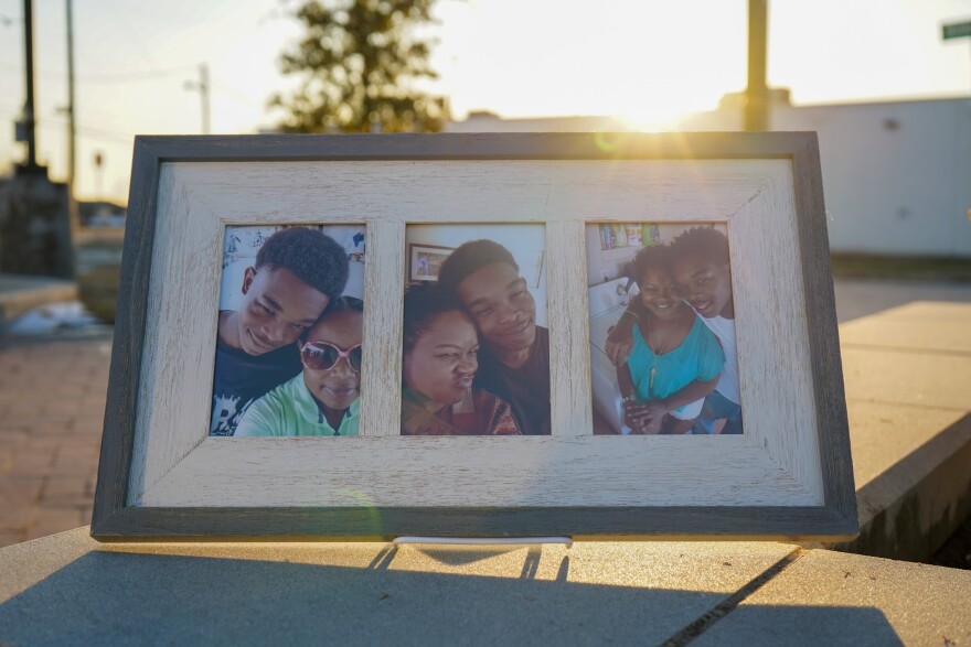 A photo of a series of three framed photos. They're selfies of Sa'Von Bell, a young Black man with short black hair, and his mother Rosalind Bell, a Black woman. They're smiling or making silly faces at the camera in each photo.