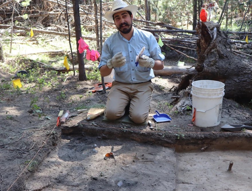 Southern Oregon University's Keoni Diacamos at work on July 21 excavating the site of a home in the vanished company town that once surrounded the Baker White Pine Mill.