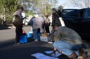 Keep Flagstaff Together volunteers gather to distribute information packets in a Flagstaff neighborhood on April 8, 2026.