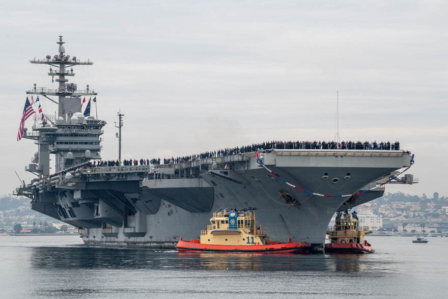 gray aircraft carrier USS Abraham Lincoln in the water